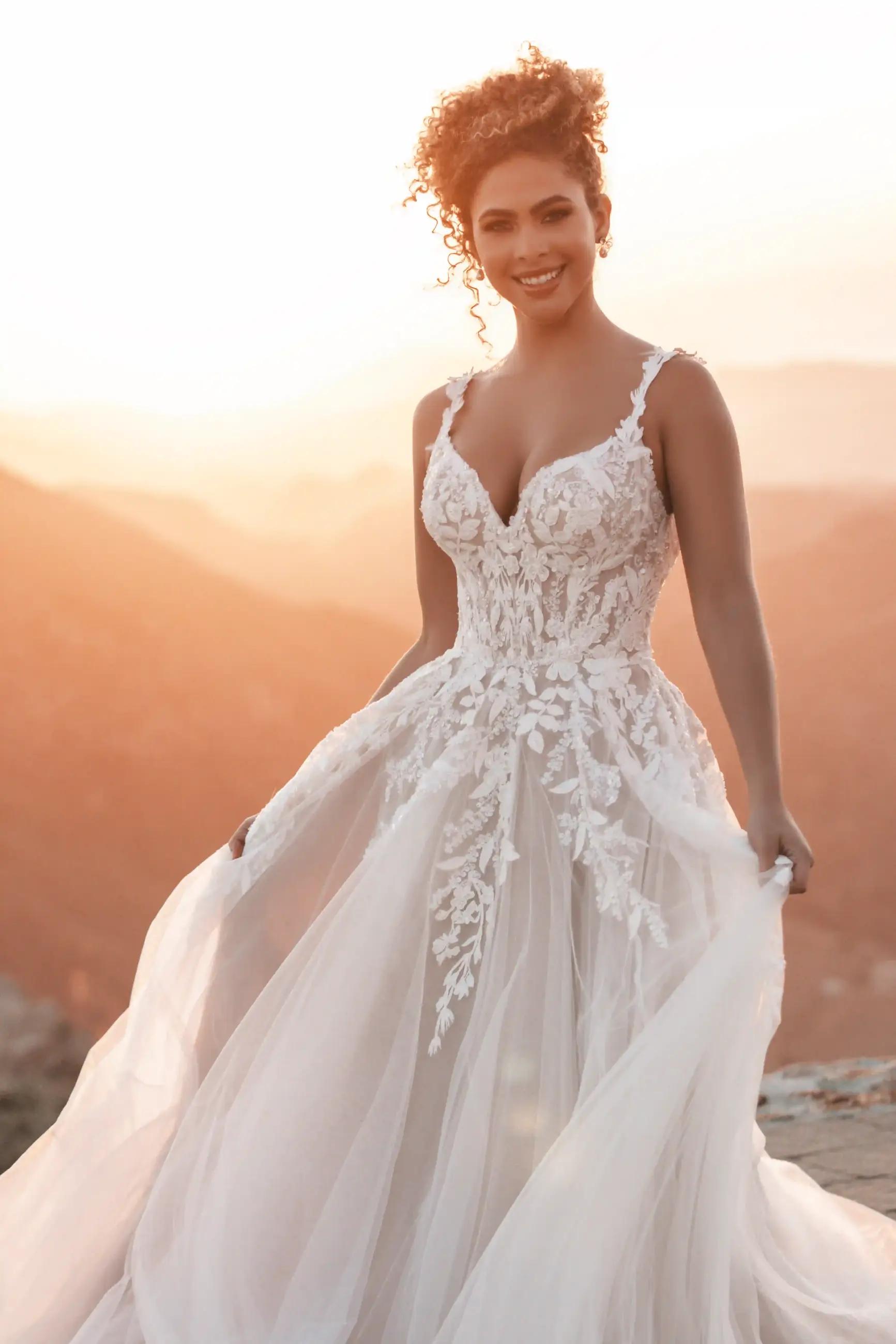 Plus size model wearing a white Allure Gown